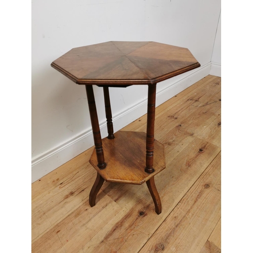 125 - Edwardian oak lamp table with segment top raised on turned columns and platform base {69 cm H x 48 c... 