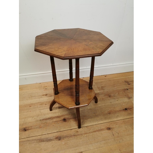 125 - Edwardian oak lamp table with segment top raised on turned columns and platform base {69 cm H x 48 c... 