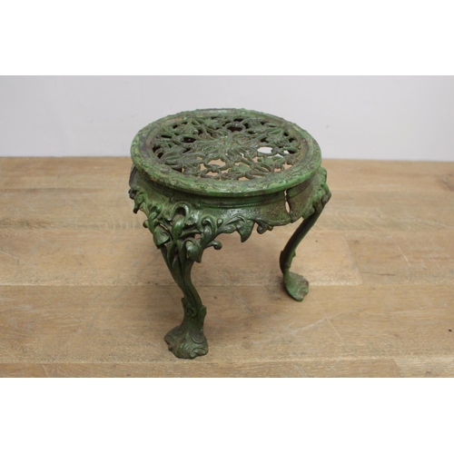 127 - Decorative cast iron plant stand raised on three shaped legs { 33cm H X 33cm Dia }.