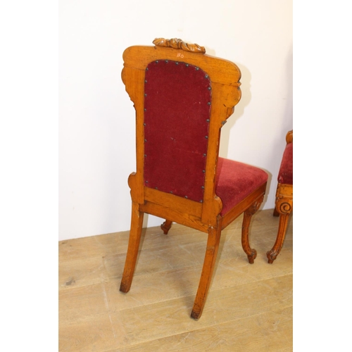 141 - Pair of upholstered oak hall chairs raised on shaped legs { 110cm H X 51cm W X 45cm D }.