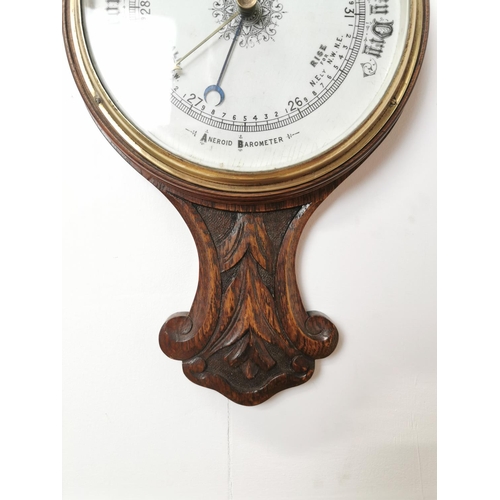 16 - 19th. C. carved oak Aneroid barometer{ 83cm H X 26cm W }.