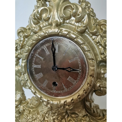 169 - 19th C. decorative cast iron mantle clock in the Rococo style. {43 cm H x 34 cm W x 15 cm D}.