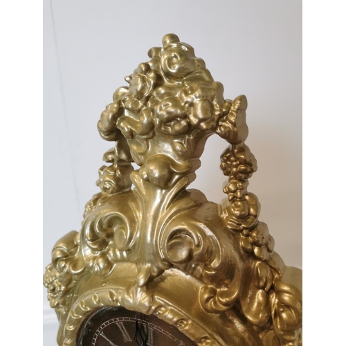 169 - 19th C. decorative cast iron mantle clock in the Rococo style. {43 cm H x 34 cm W x 15 cm D}.