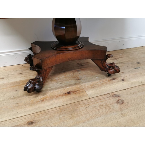 175 - 19th C. mahogany double drop leaf side table raised on bulbous column four outswept legs and lion's ... 