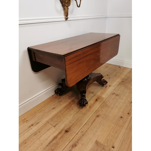 175 - 19th C. mahogany double drop leaf side table raised on bulbous column four outswept legs and lion's ... 