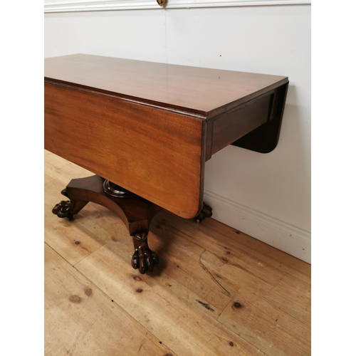 175 - 19th C. mahogany double drop leaf side table raised on bulbous column four outswept legs and lion's ... 