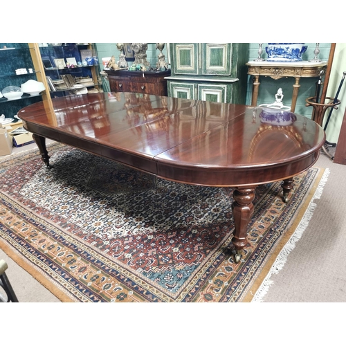 227 - Mahogany dining room tableraised on turned tapered legs with brass casters,  in the Victorian style ... 