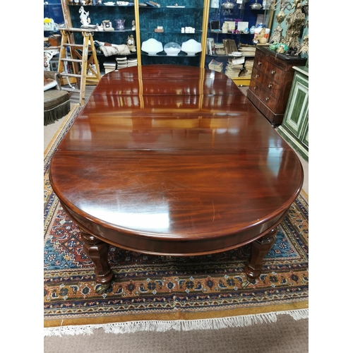 227 - Mahogany dining room tableraised on turned tapered legs with brass casters,  in the Victorian style ... 