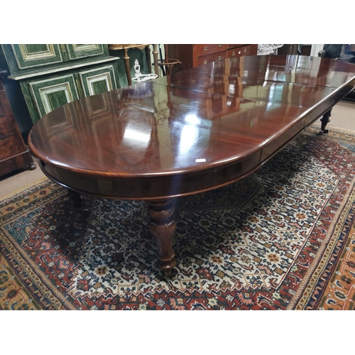 227 - Mahogany dining room tableraised on turned tapered legs with brass casters,  in the Victorian style ... 