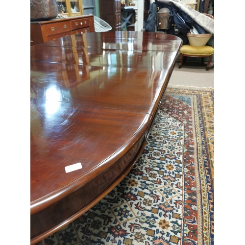 227 - Mahogany dining room tableraised on turned tapered legs with brass casters,  in the Victorian style ... 