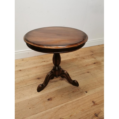 230 - Mahogany lamp table raised on turned column and three outswept legs { 60cm H }.