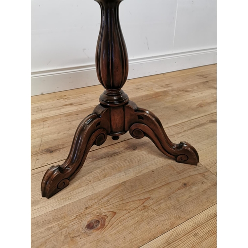 230 - Mahogany lamp table raised on turned column and three outswept legs { 60cm H }.