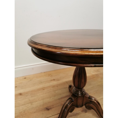 230 - Mahogany lamp table raised on turned column and three outswept legs { 60cm H }.