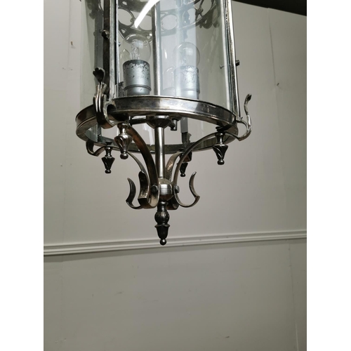 245 - Polished metal hall lantern with four lights { 68cm H X 80cm Dia }.