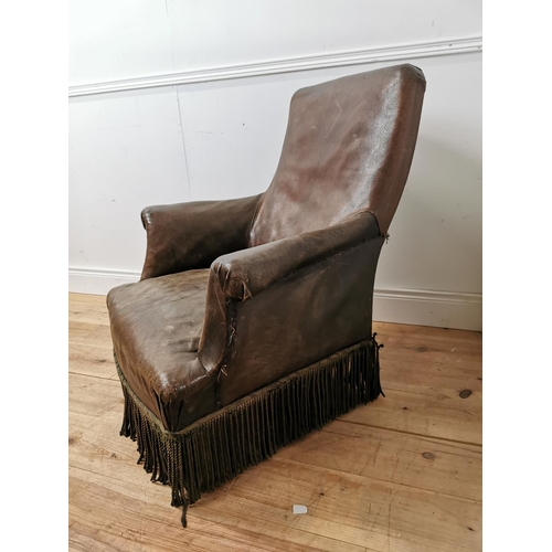 254 - 19th. C. leather upholstered armchair raised on turned legs  { 90cm H X 82cm W X 80cm D }.