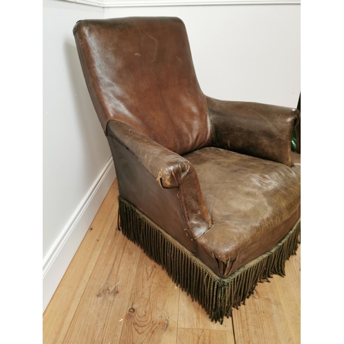 254 - 19th. C. leather upholstered armchair raised on turned legs  { 90cm H X 82cm W X 80cm D }.