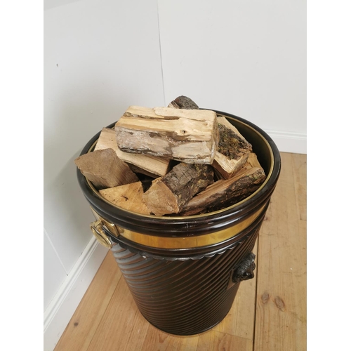 261 - Brass bound mahogany peat bucket in the Irish Georgian style { { 66cm H X 53cm Dia }.