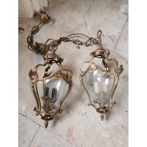 265 - Pair of decorative brass and glass hanging lanterns { 70cm H X 25cm Dia }.