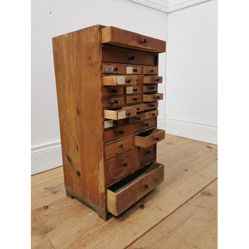 28 - Early 20th. C. pine watch maker's drawers, the two long drawers over eighteen short drawers, four sh... 