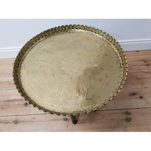 280 - 1950's mahogany and brass Indian tea table {55 cm H x 57 cm Dia.}.