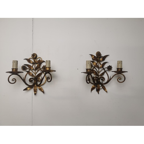 288 - Pair of gilded metal two branch wall sconces { 25cm H X 25cm W X 13cm D }.