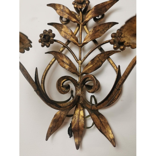 288 - Pair of gilded metal two branch wall sconces { 25cm H X 25cm W X 13cm D }.