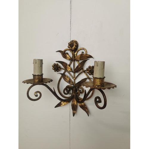 288 - Pair of gilded metal two branch wall sconces { 25cm H X 25cm W X 13cm D }.