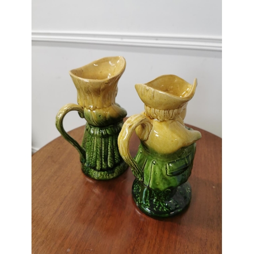 29 - Pair of glazed earthen ware Toby jugs { 24cm H X 11cm W X 16cm D }.