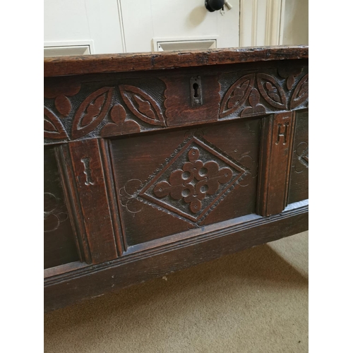 295 - 18th C. carved oak coffer on square reeded legs {75 cm H x 135 cm W x 52 cm D}.