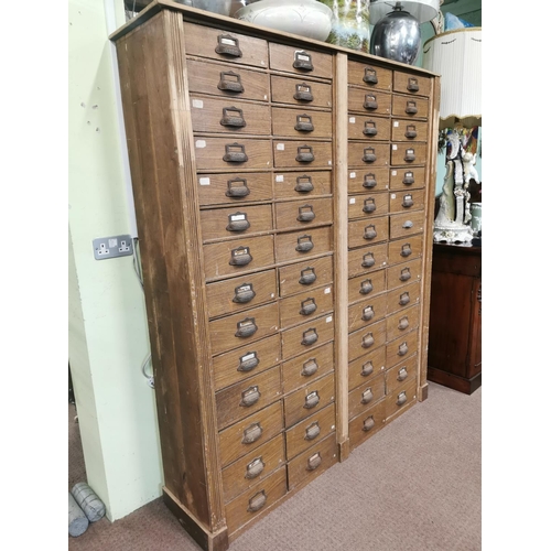 303 - Early 20th. C. scumbled pine bank of fifty six drawers { 188cm H X 163cm W X 39cm D }.