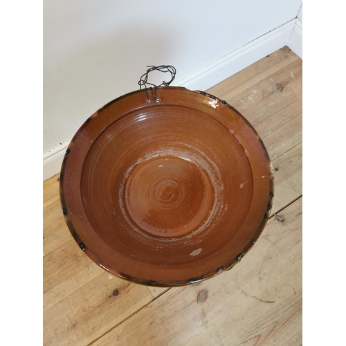 311 - Early 20th C glazed terracotta bowl on wrought iron stand. {67 cm H x 36 cm Diam}.