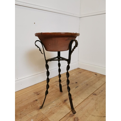 311 - Early 20th C glazed terracotta bowl on wrought iron stand. {67 cm H x 36 cm Diam}.