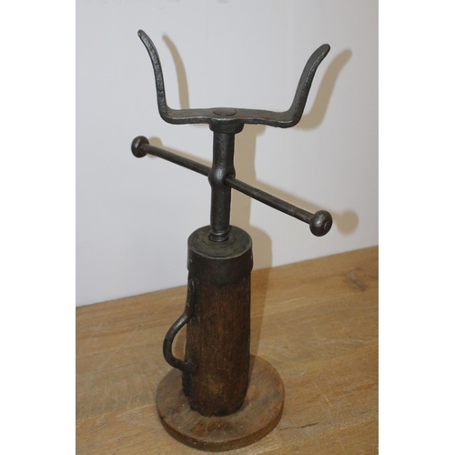 317 - 19th. C. cast iron and wooden wagon jack { 73cm H X 40cm W X 25cm D }.