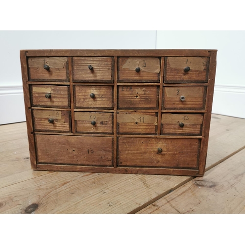 32 - Early 20th. C. pine watch maker's drawers, the twelve short drawers  over two deep drawers..  { 23cm... 