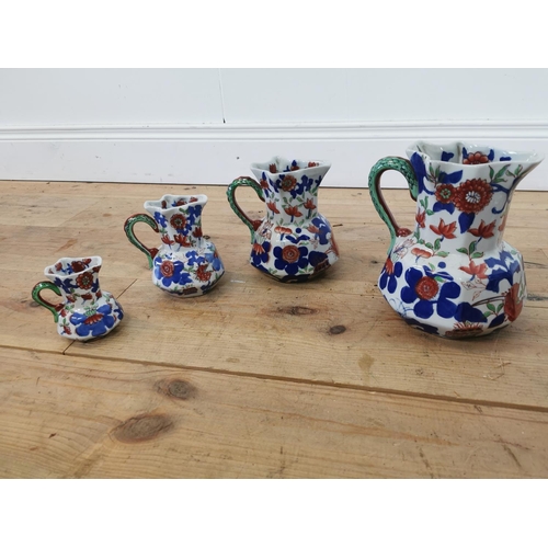 331 - Set of five graduated hand painted stoneware water jugs.  Largest {25 cm H x 20 cm W x 23 cm D} and ... 