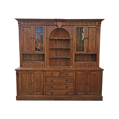 349 - Pine kitchen cabinet the centre arch with three shaped shelves flanked by glazed  and panelled doors... 