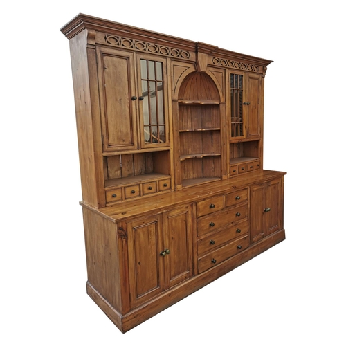 349 - Pine kitchen cabinet the centre arch with three shaped shelves flanked by glazed  and panelled doors... 