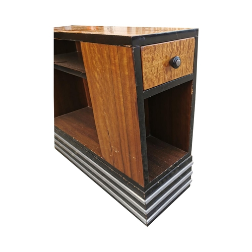 356 - Pair of Art Deco walnut and ebony side cabinets decorated with aluminium strips, the single frieze d... 