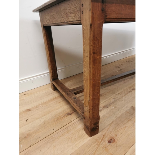 364 - 18th. C. oak kitchen table raised on champhered square legs with single stretcher { 75cm H X 193cm W... 