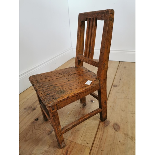 373 - 19th C . Painted pine child's chair raised on square legs. {54 cm H x 28 cm W x 21 cm D}.