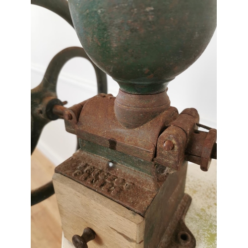 375 - Early 20th C cast iron coffee grinder. { 36 cm H x 44 cm W x 30 cm D}.