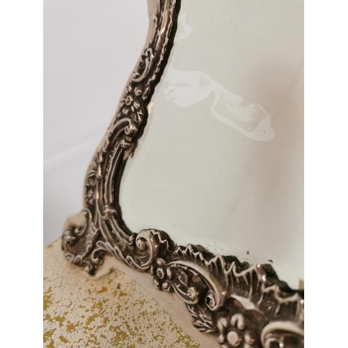 379 - 19th C. decorative silver table mirror. {31 cm H x 24 cm W}.