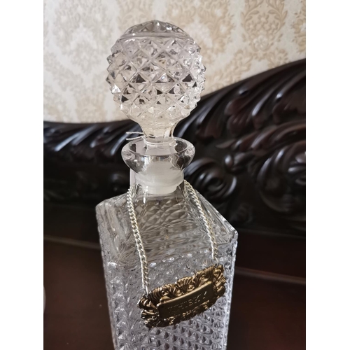 384 - Cut glass whiskey decanter and cut glass brandy decanter { 28cm H & 26cm H }.