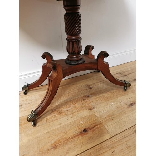 390 - Good quality Regency mahogany turn over leaf tea table raised on turned column and four outswept fee... 