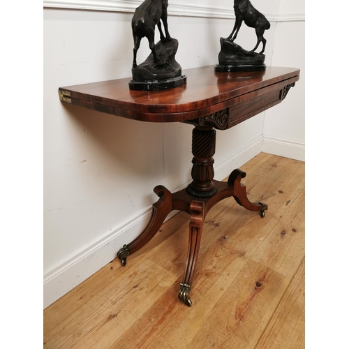 390 - Good quality Regency mahogany turn over leaf tea table raised on turned column and four outswept fee... 