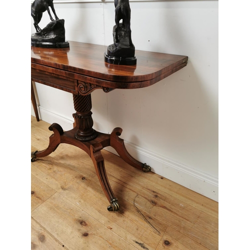 390 - Good quality Regency mahogany turn over leaf tea table raised on turned column and four outswept fee... 