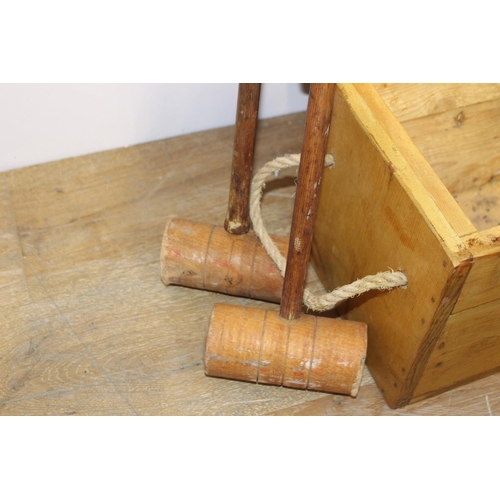 394 - Croquet set in original box { 25cm H X 107cm W X 23cm D }.