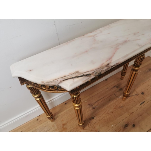 398 - Giltwood consul table the marble top above an open work frieze raised on turned tapered legs { 74cm ... 