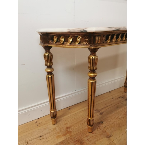 398 - Giltwood consul table the marble top above an open work frieze raised on turned tapered legs { 74cm ... 