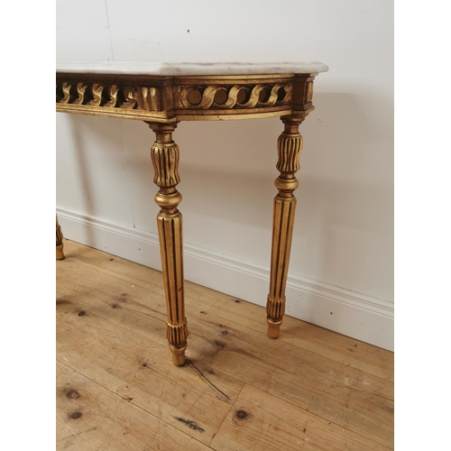 398 - Giltwood consul table the marble top above an open work frieze raised on turned tapered legs { 74cm ... 